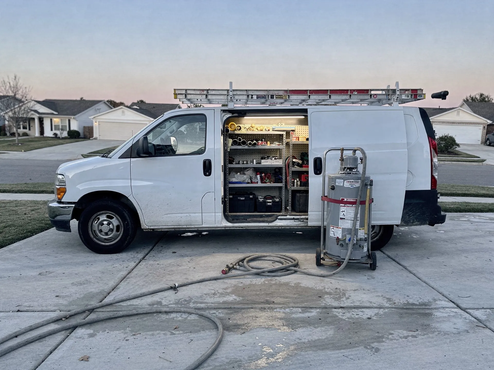 Plumbing crew at work, early morning